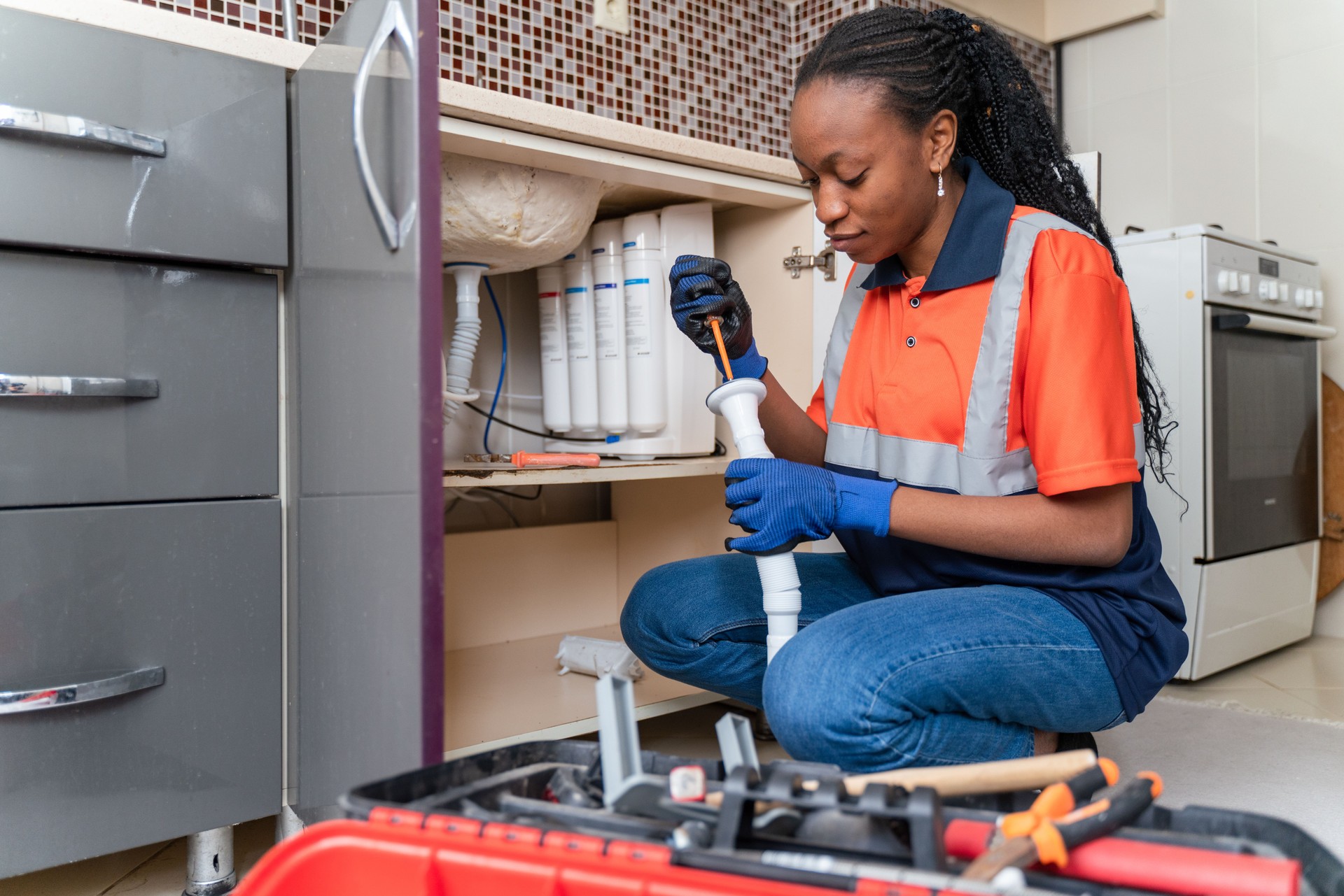 Black female plumber at work Black female plumber at work